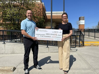 2025 recipient Sarah Lenarduzzi (R) with Trustee, Jeff Klassen (L)