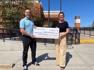 Board Trustee Jeff Klassen (L) presenting the Inaugural Dr. Elliot Sampson Professional Development Award to Sarah Lenarduzzi (R)