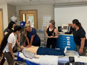 Students using the Anne Manikin at the Leduc Community Hospital.